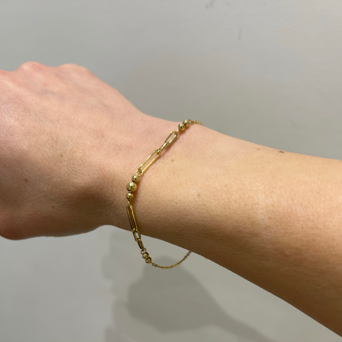 9K gold link bracelet handmade in Greece, styled on wrist